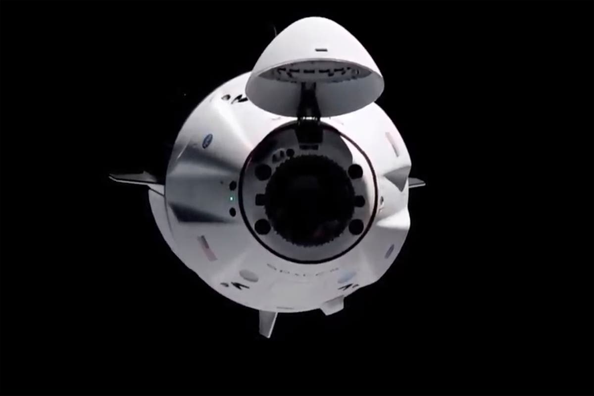 Old SpaceX capsule delivers new crew to space station