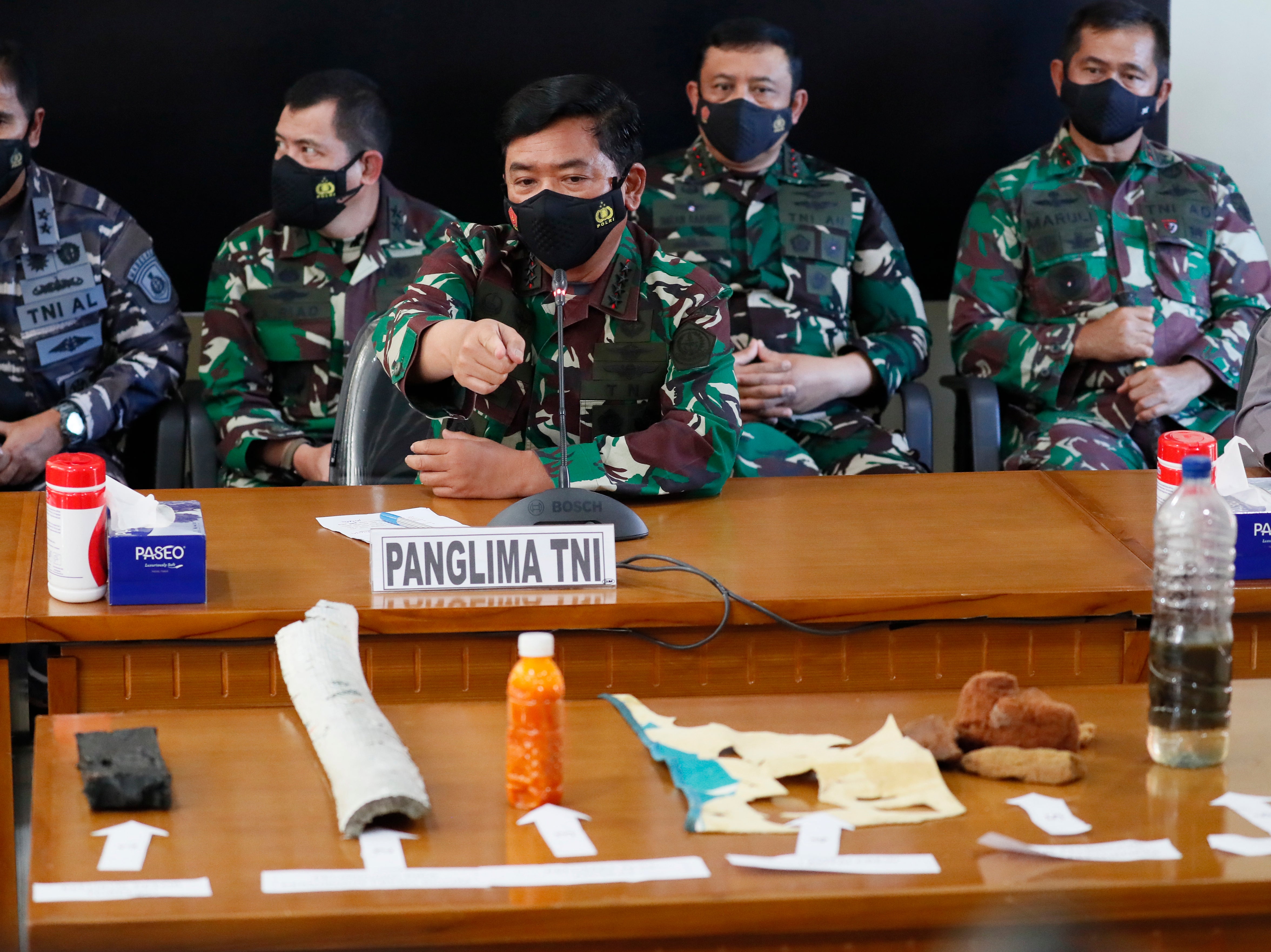 Indonesian military Chief Hadi Tjahjanto displays debris believed to be from missing Indonesian Navy submarine KRI Nanggala