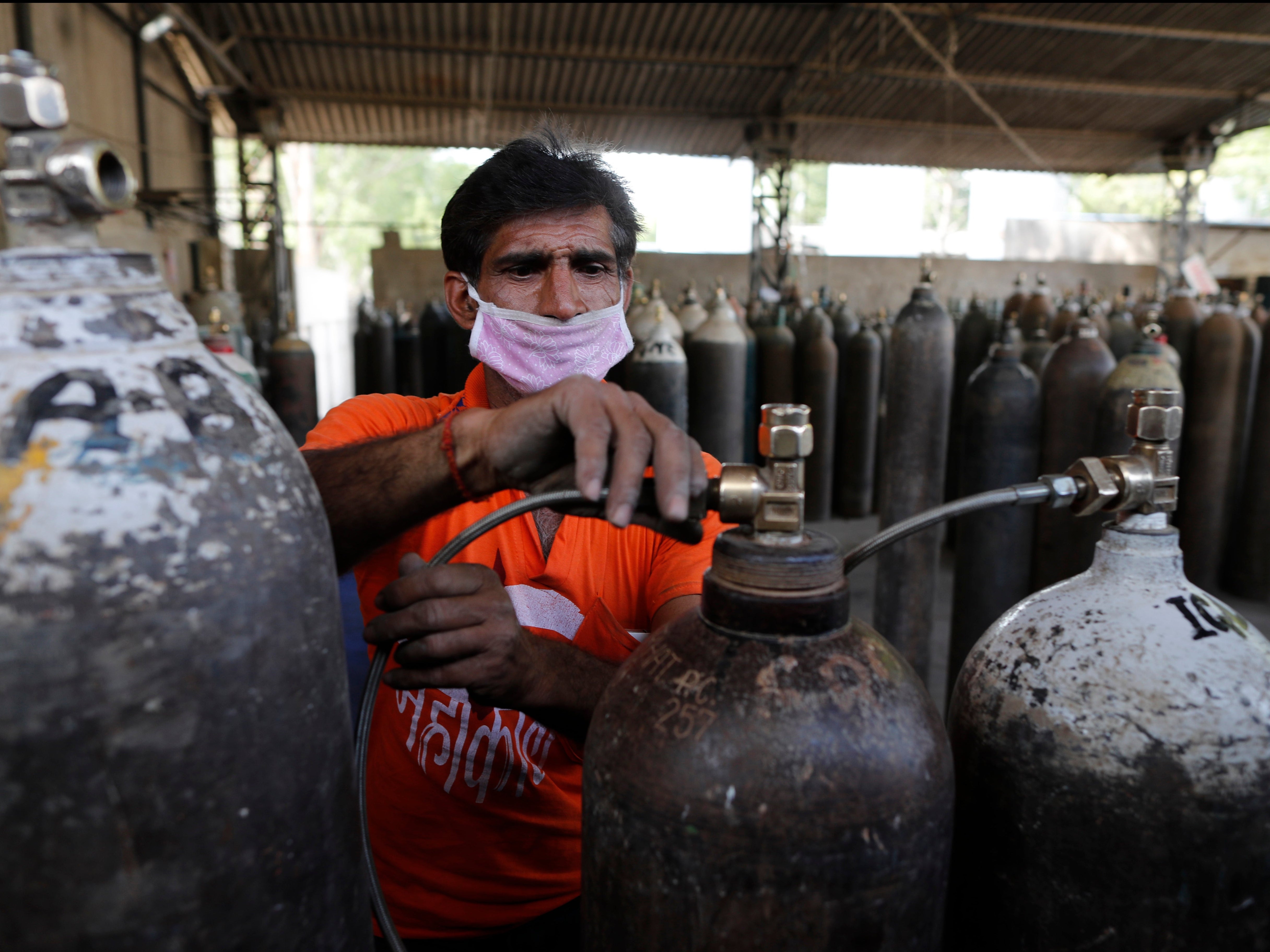 India Covid latest: Patients suffocating from lack of oxygen as hospitals turn people away