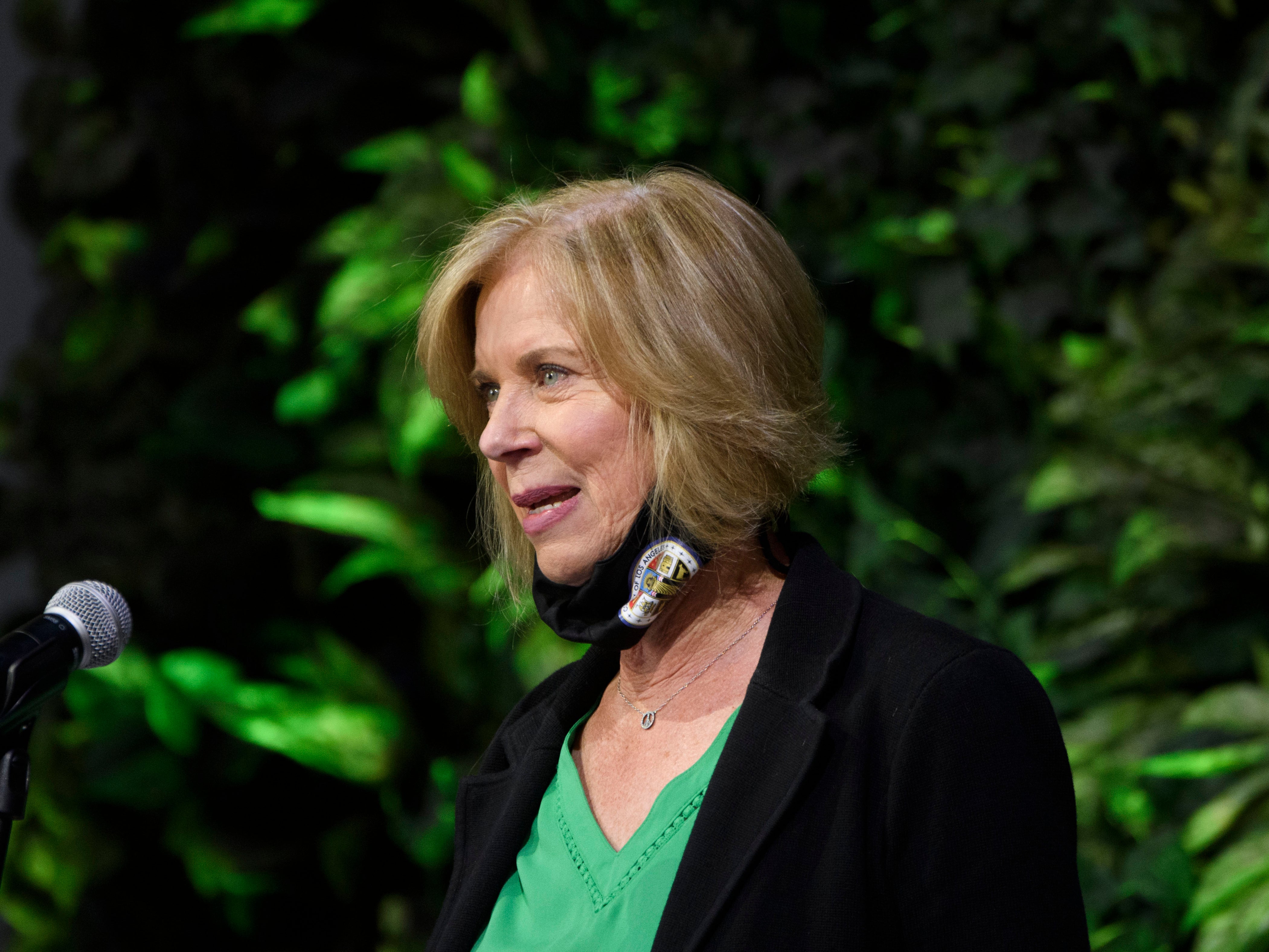 Los Angeles County Supervisor Janice Hahn speaks after touring a Covid-19 vaccination site on 22 February, 2021 in Long Beach, California