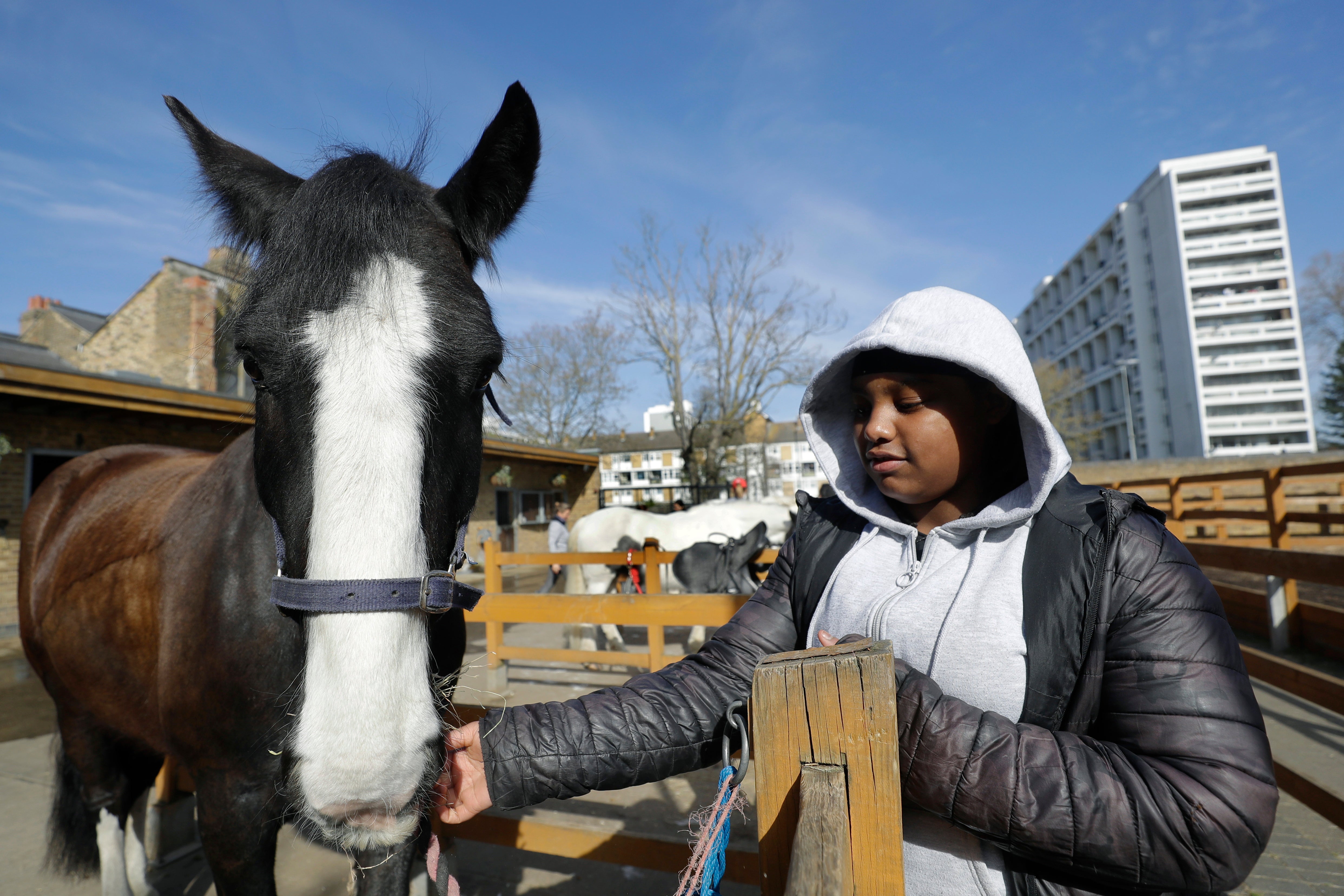 AP PHOTOS: London riding club inspires children to saddle up Ebony