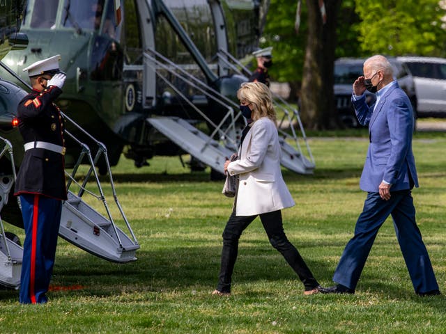 First lady Jill Biden and U.S. President Joe Biden walk on the ellipse to Marine One on April 24, 2021 in Washington, DC. 