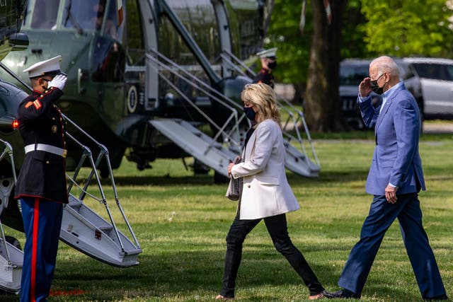 First lady Jill Biden and U.S. President Joe Biden walk on the ellipse to Marine One on April 24, 2021 in Washington, DC. 