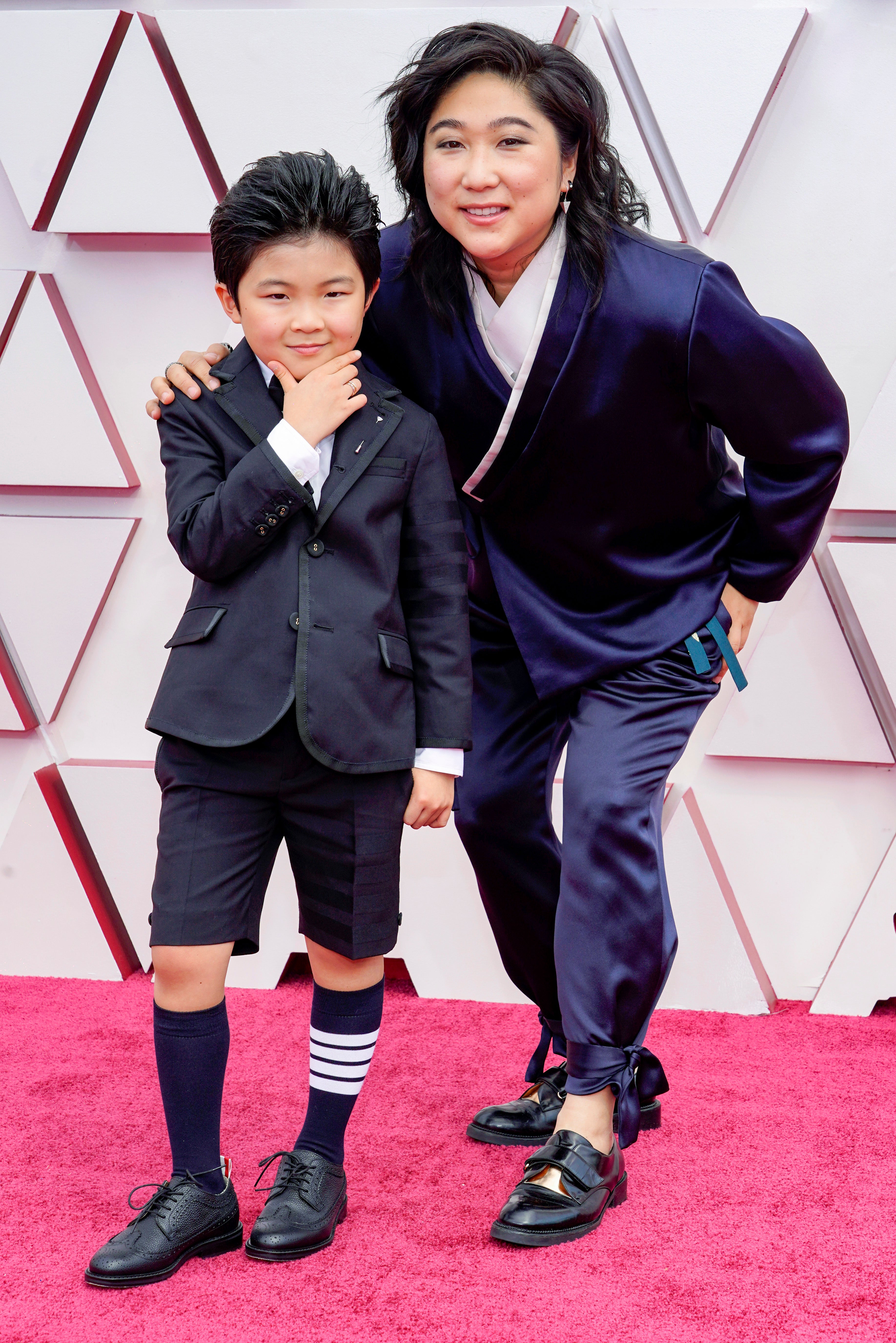 Alan S Kim wearing Thom Browne and Vicky Kim on the Oscars red carpet