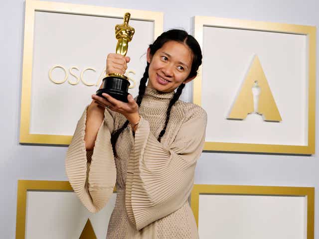 Chloé Zhao poses after winning the Academy Award for Best Picture for Nomadland