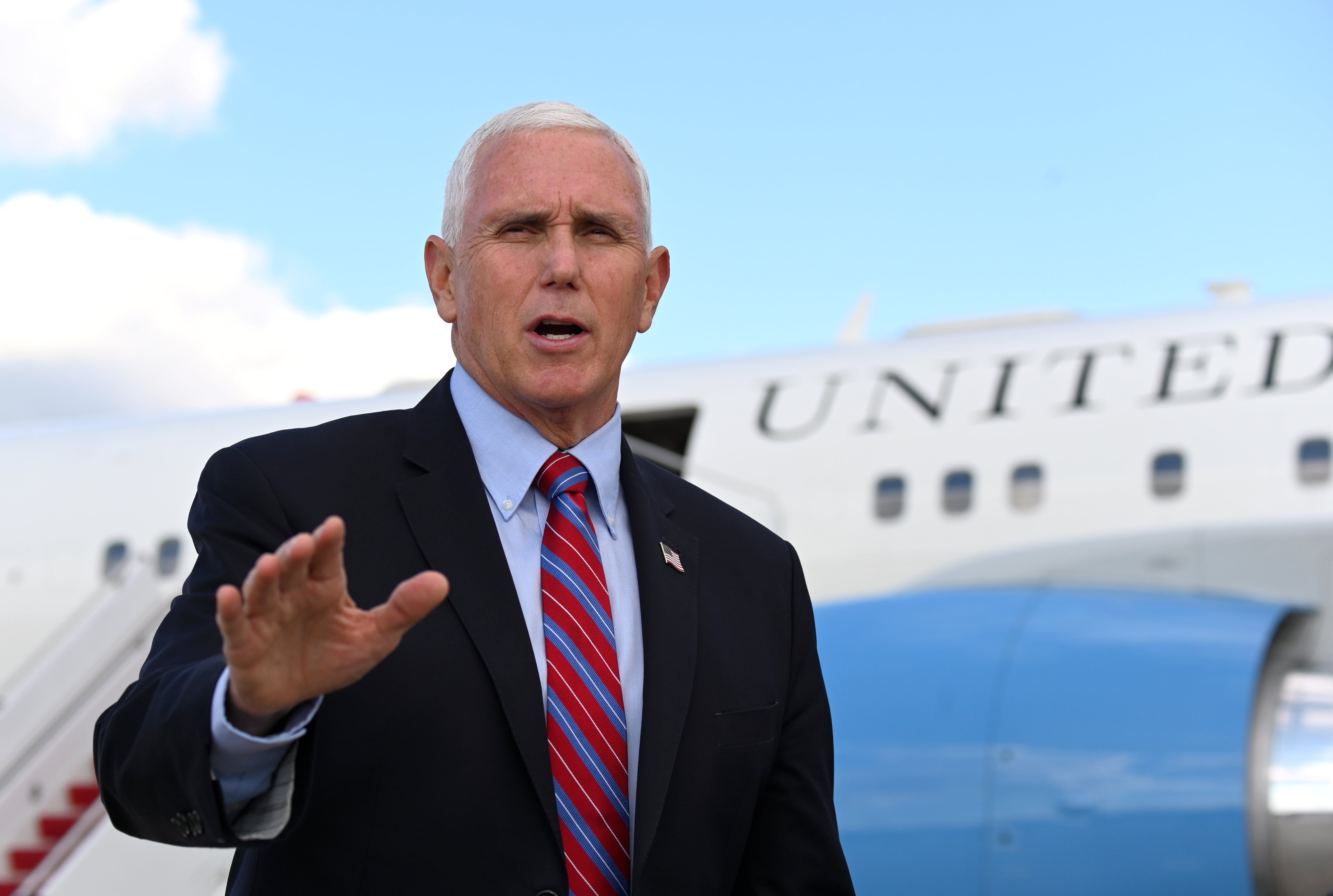 File: US vice president Mike Pence talks to the media before departing for travel to the vice presidential debate in Salt Lake City, Utah