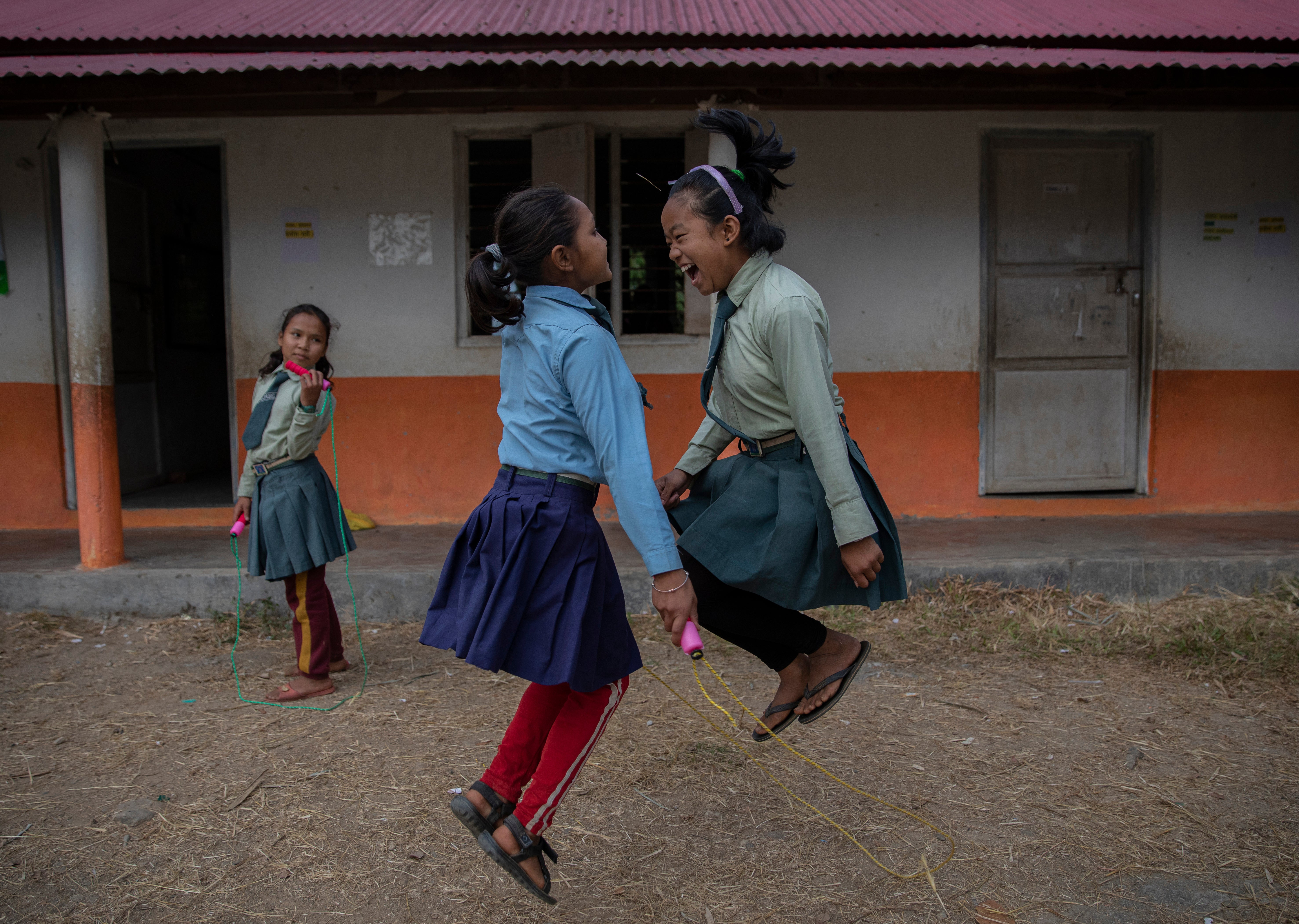 Pupils skipping during a break at the United World Schools Heluwabesi school in Nepal