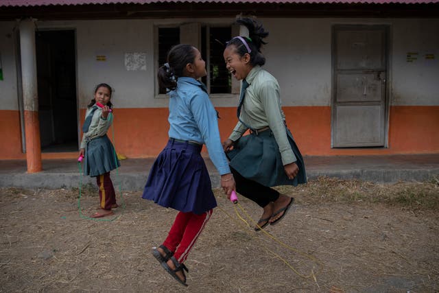 <p>Pupils skipping during a break at the United World Schools Heluwabesi school in Nepal</p>