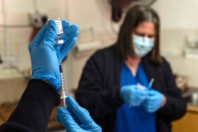 Doctors in Cypus prepare for a vaccination using the AstraZeneca COVID-19 vaccine