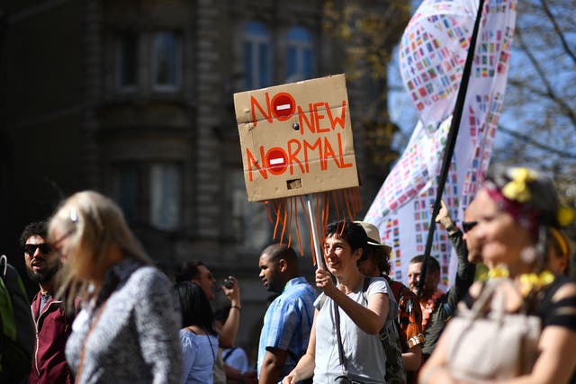 Demonstrators take part in an anti-lockdown, anti-Covid-19 vaccination passport protest in central London
