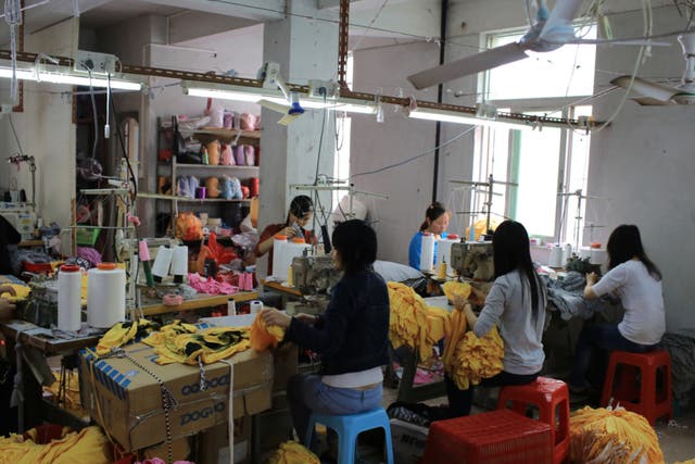 Garment workers work in a small clothing factory in China. A cross-party group of MPs and peers are calling on fast fashion giants to do more to ensure garment workers in their supply chains can earn a living wage