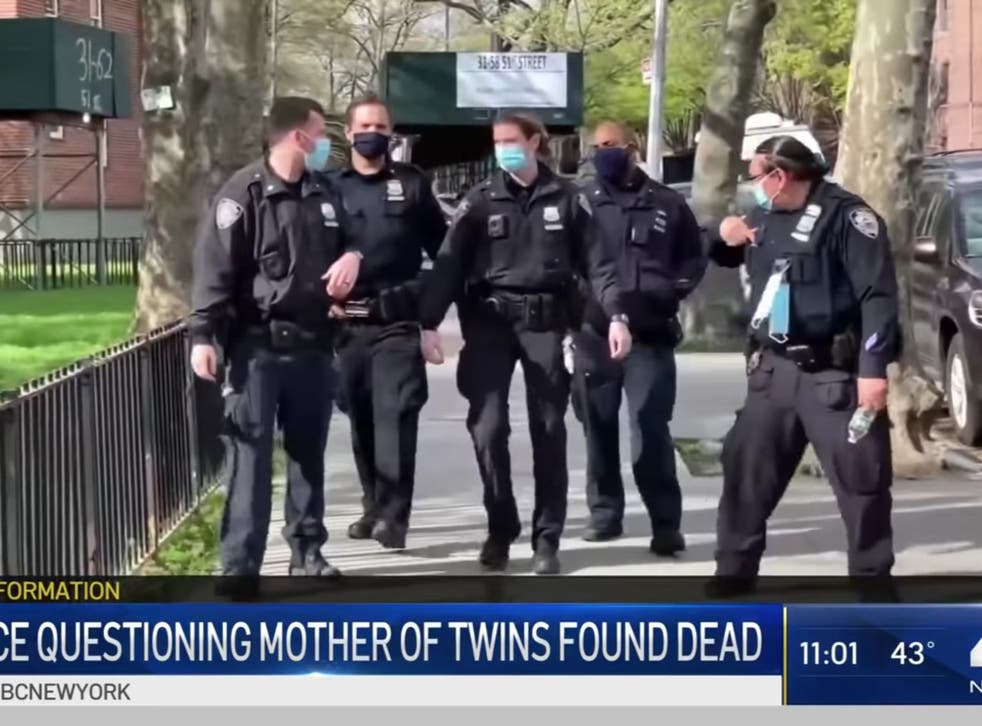 <p>Officers search an apartment after deaths of twins in Queens, New York</p>