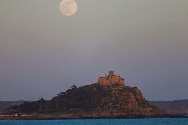 The supermoon rises above St Michael’s Mount on 26 April 2021 in Penzance, England