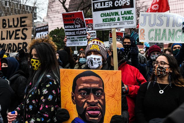 <p>People protest outside of the Courthouse during the trial of former Minneapolis police officer charged with murdering George Floyd in Minneapolis, Minnesota on 19 April, 2021</p>