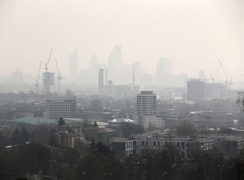 <p>Air pollution and smog blankets the City of London, campaigners are calling for legal limits on air pollution in the UK </p>