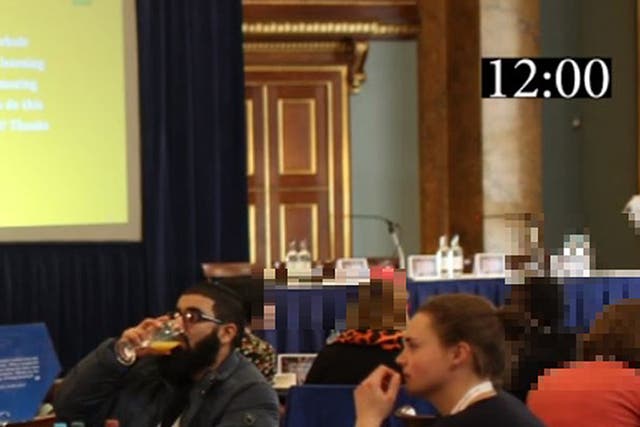 <p>A photo shown in court during the inquest shows Usman Khan  and Saskia Jones sat at a table together at the November 2019 prisoner rehabilitation event near London Bridge</p>