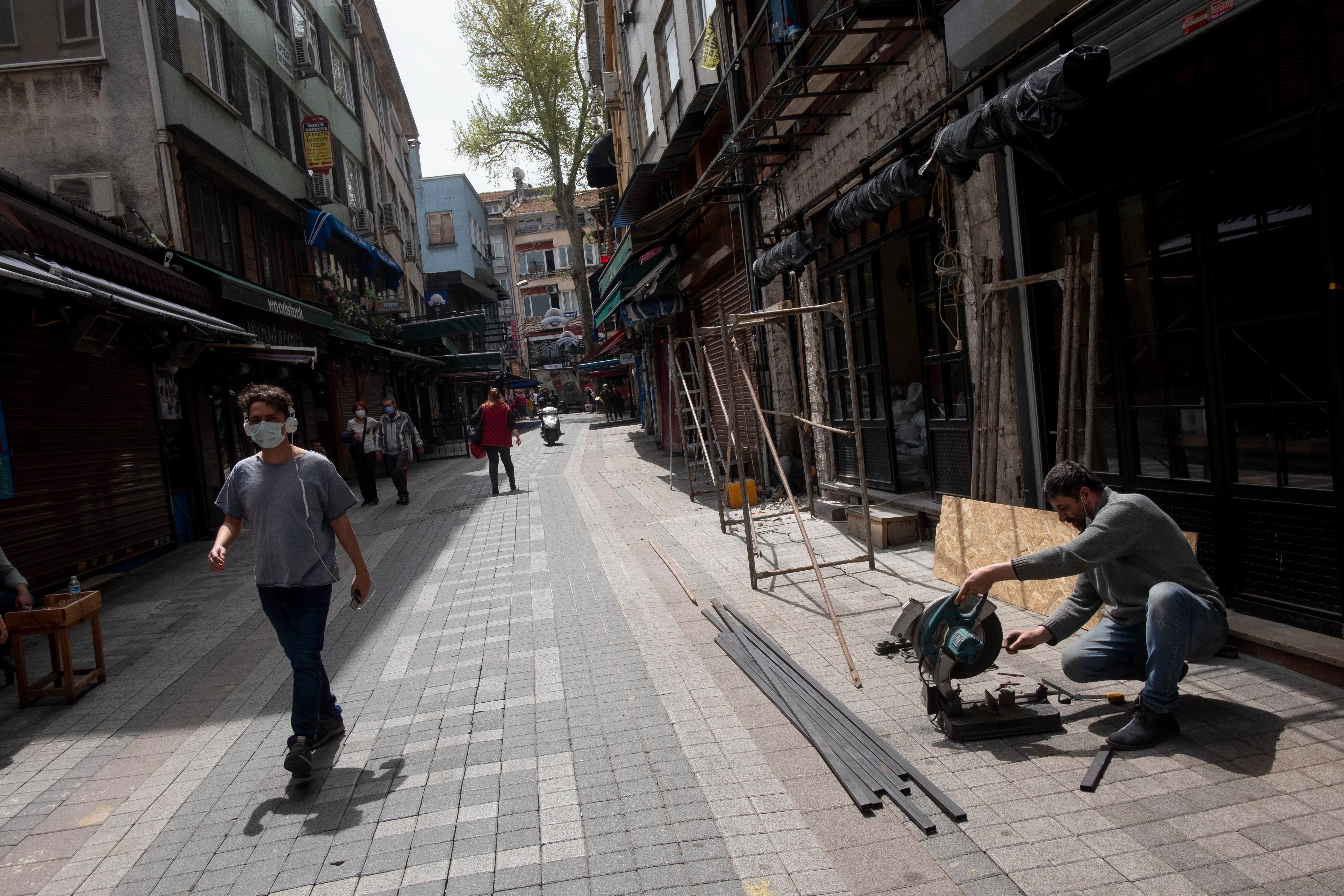 Istanbul street once a draw for drinking and merriment now shuttered because of coronavirus restrictions.