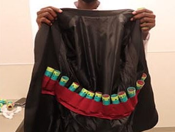 <p>The jacket containing the finches stuffed in hair rollers</p>