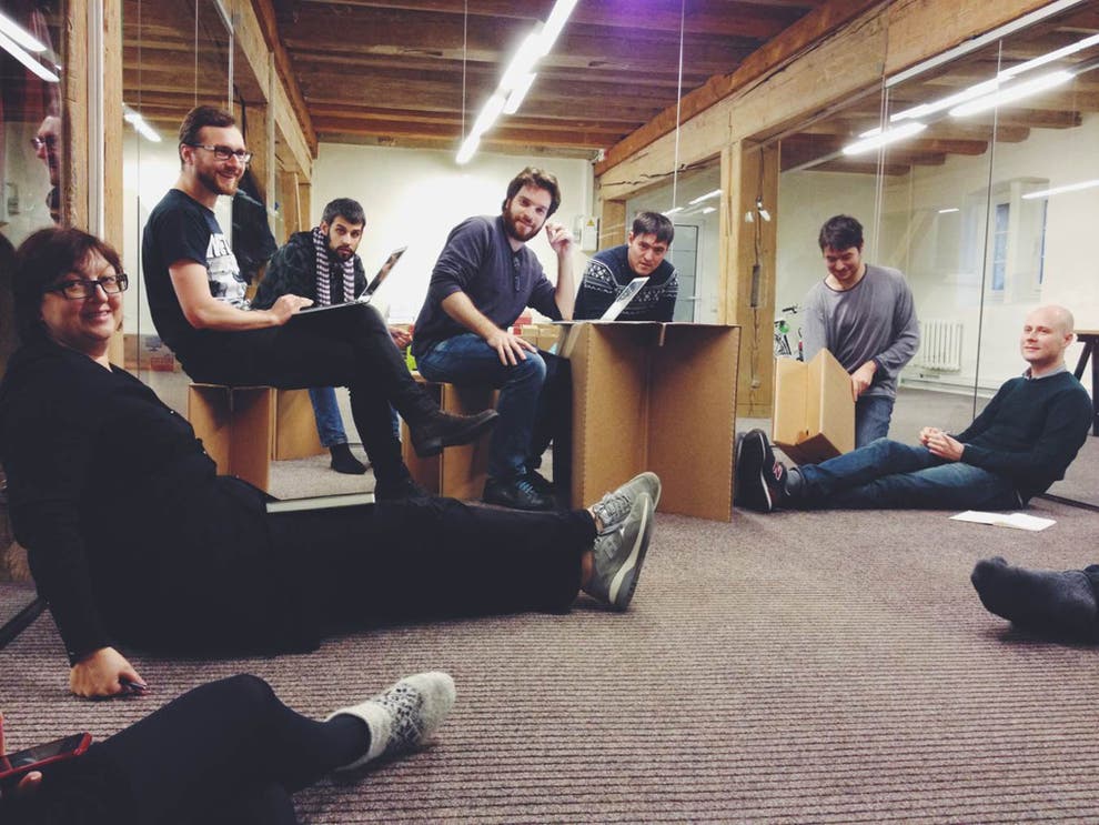 Galina Timchenko (left) stretches out on the floor of the Meduza office with her colleagues