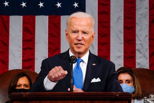 <p>US President Joe Biden, flanked by US Vice President Kamala Harris (L) and Speaker of the House of Representatives Nancy Pelosi (R), addresses a joint session of Congress at the US Capitol in Washington, DC, on April 28, 2021.</p>