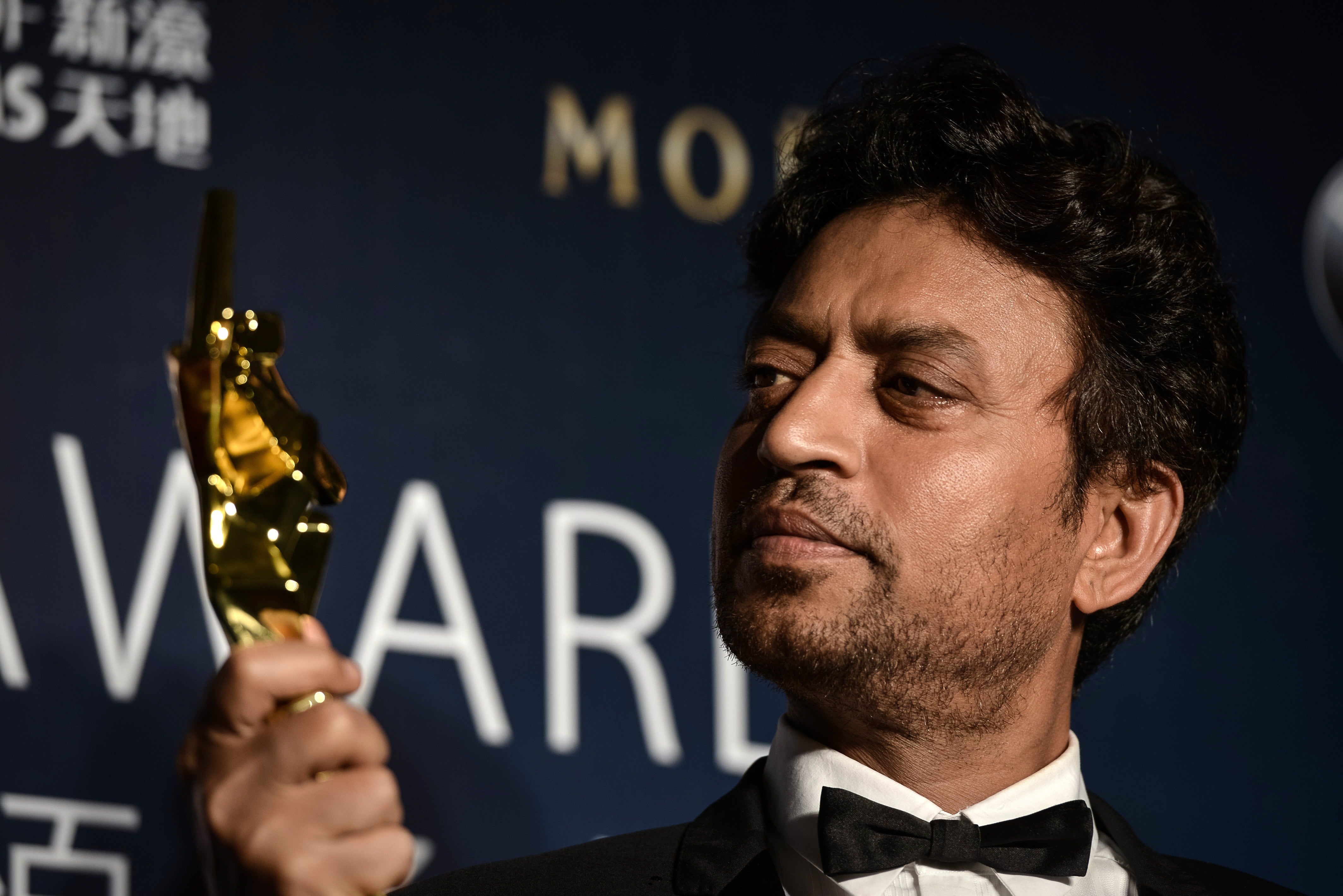 File image: Irrfan Khan poses with his trophy during the Asian Film Awards in 2014