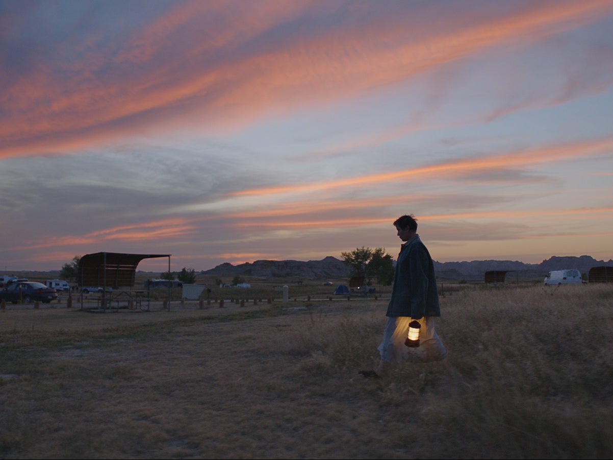 The camera watches on with reverence as Fern (Frances McDormand) marches through the desert, with only a solitary lamp to guide her way through the pink-purple sunset