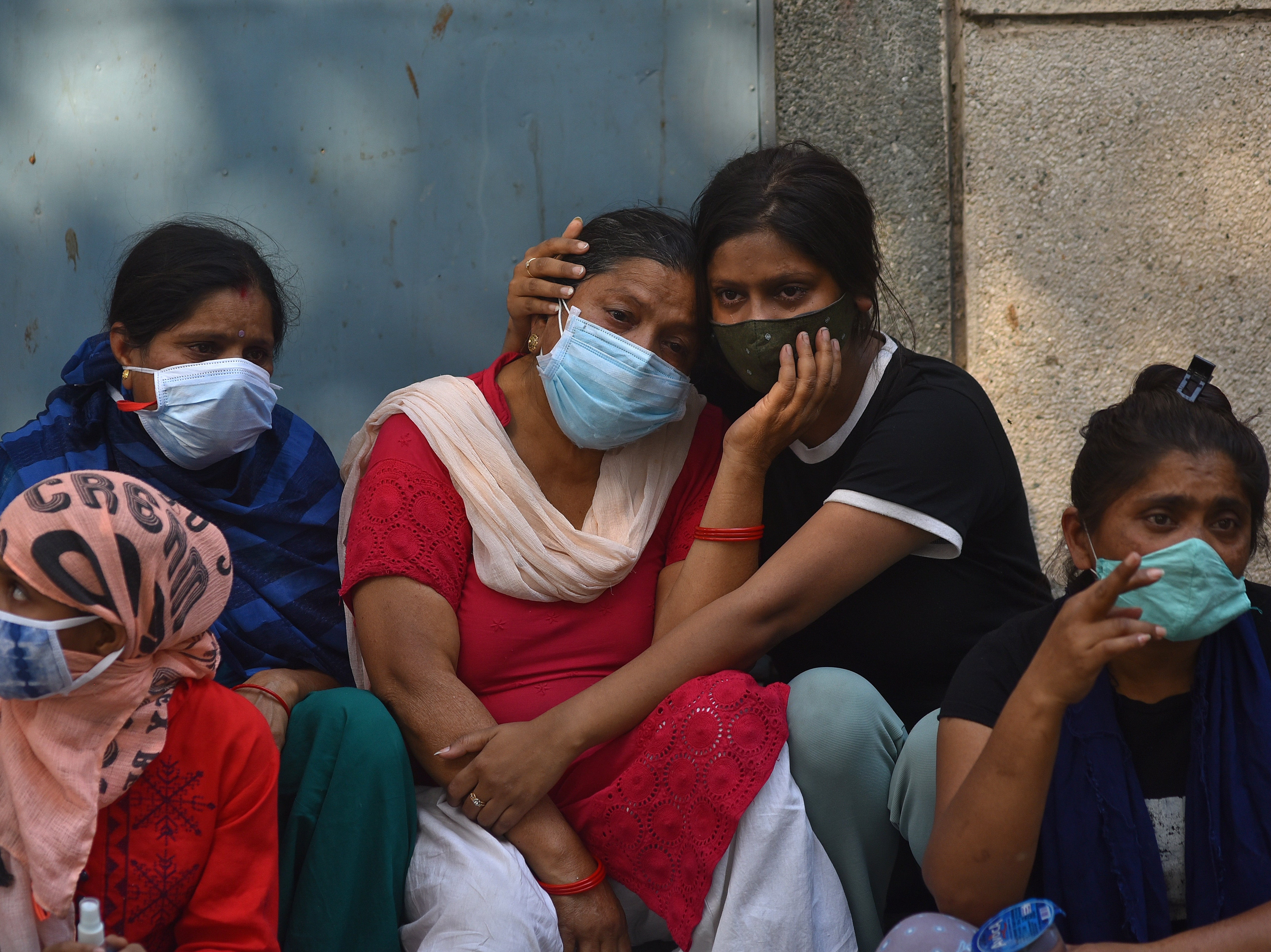 Grieving family members of COVID-19 victims at a cremation ground in New Delhi, India, 29 April 2021. Delhi High Court judges on Thursday tore into the Centre for claiming capital has sufficient oxygen supplies.