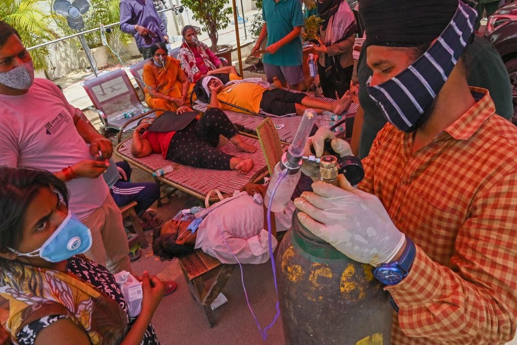 Covid patients are given oxygen in a roadside tent in Ghaziabad, near New Delhi