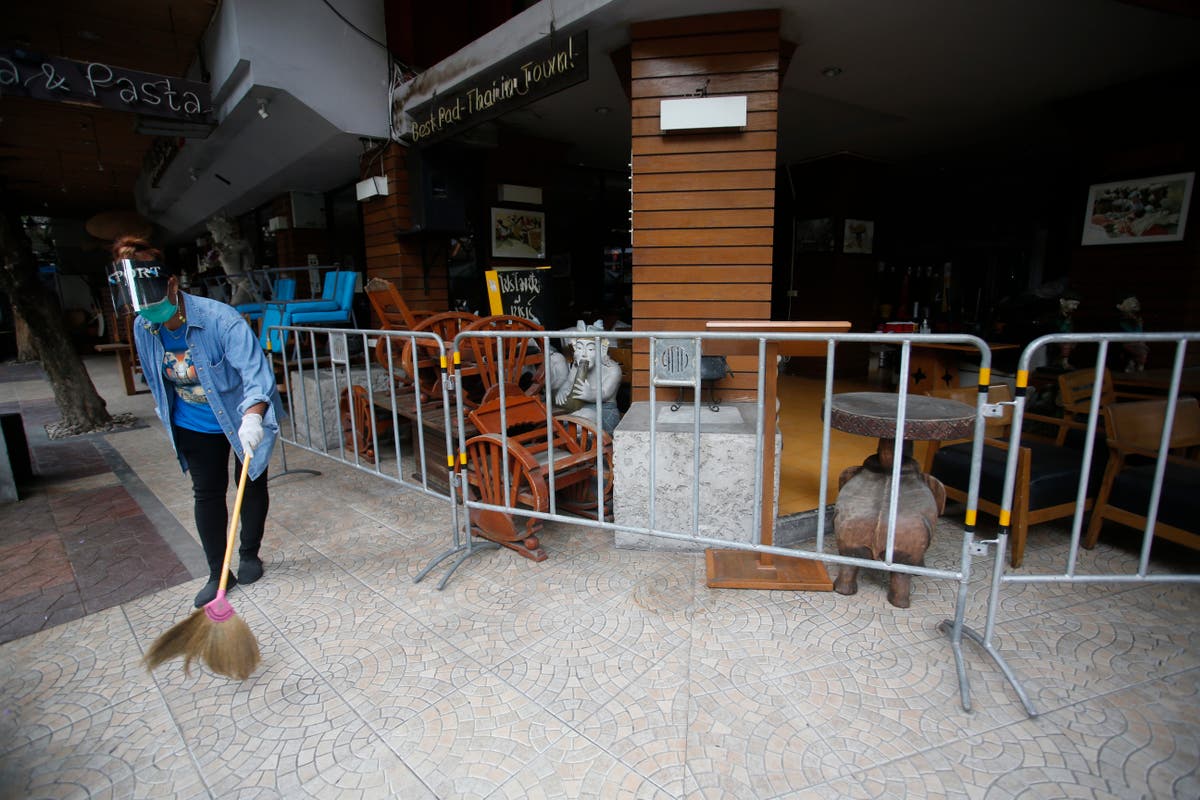 Thailand says COVID-19 has peaked, but adds restrictions
