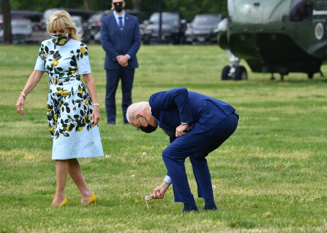 Joe Biden picks a dandelion flower for First Lady Jill Biden