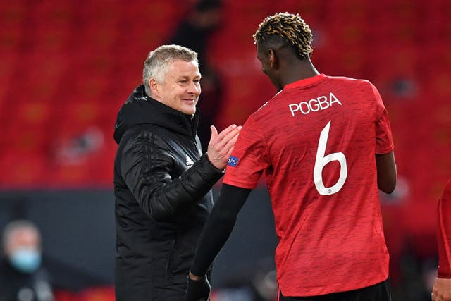 Ole Gunnar Solskjaer congratulates Manchester United midfielder Paul Pogba