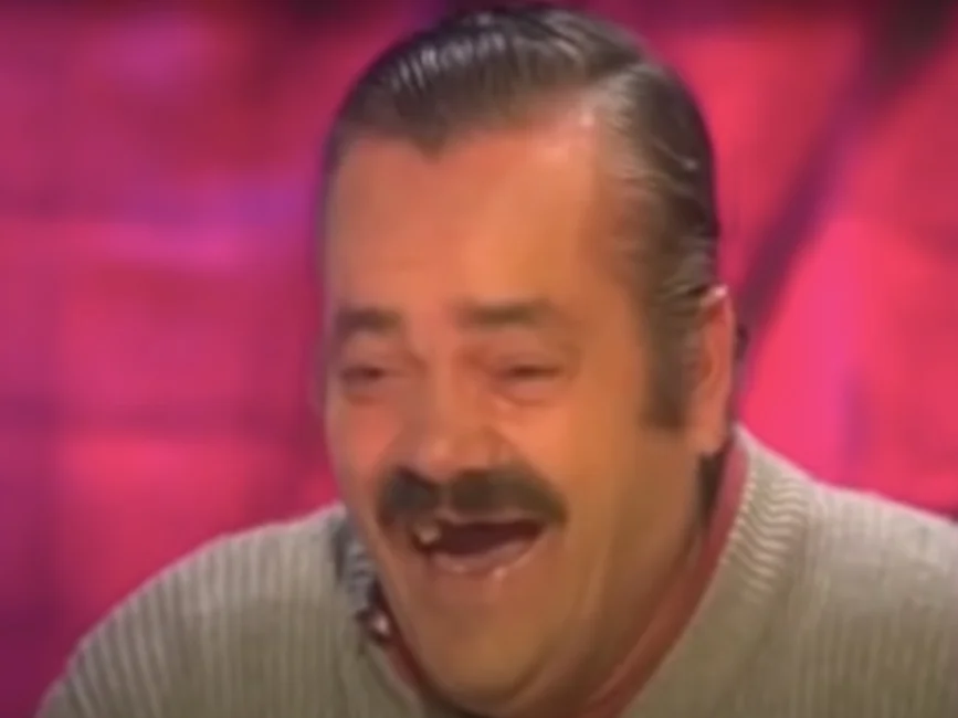 Juan Joya Borja laughing during an interview meme