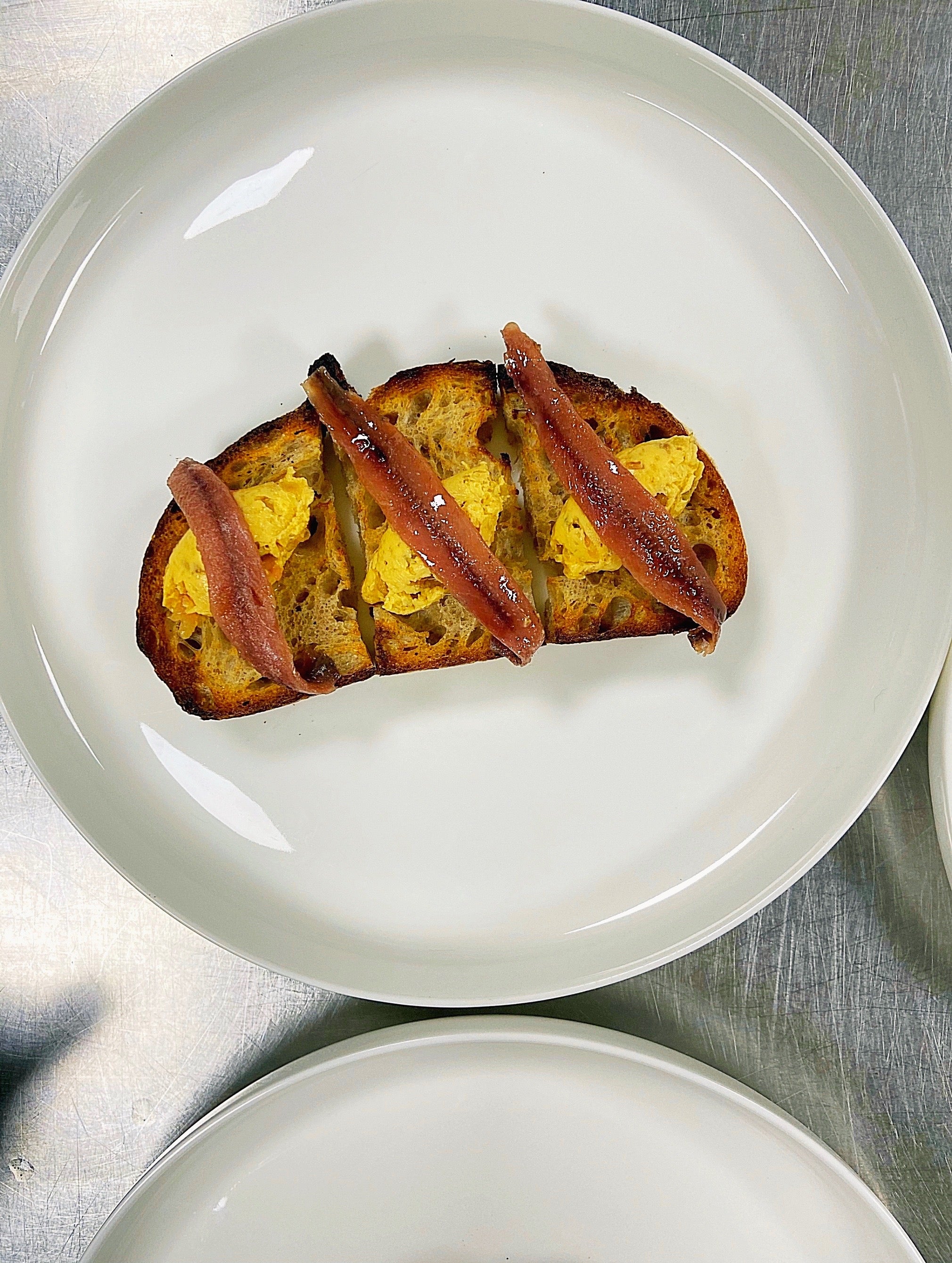 Egg and anchovies. Don’t underestimate what you can put on a piece of toast