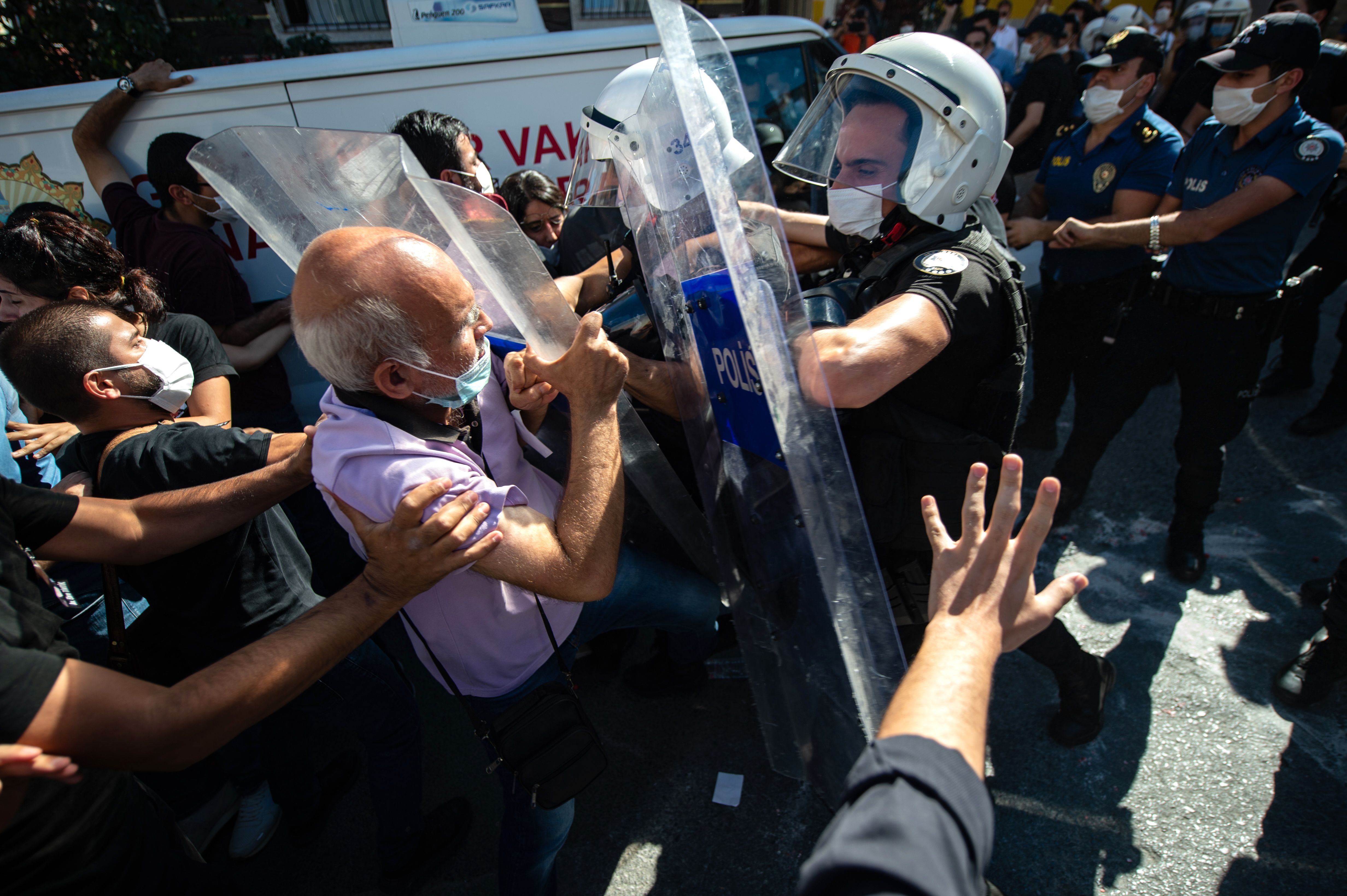 People clash with police ahead of the funeral of Turkish lawyer Ebru Timtik. She died in an Istanbul hospital on the 238th day of her hunger strike. She was charged with membership of a terrorist organisation