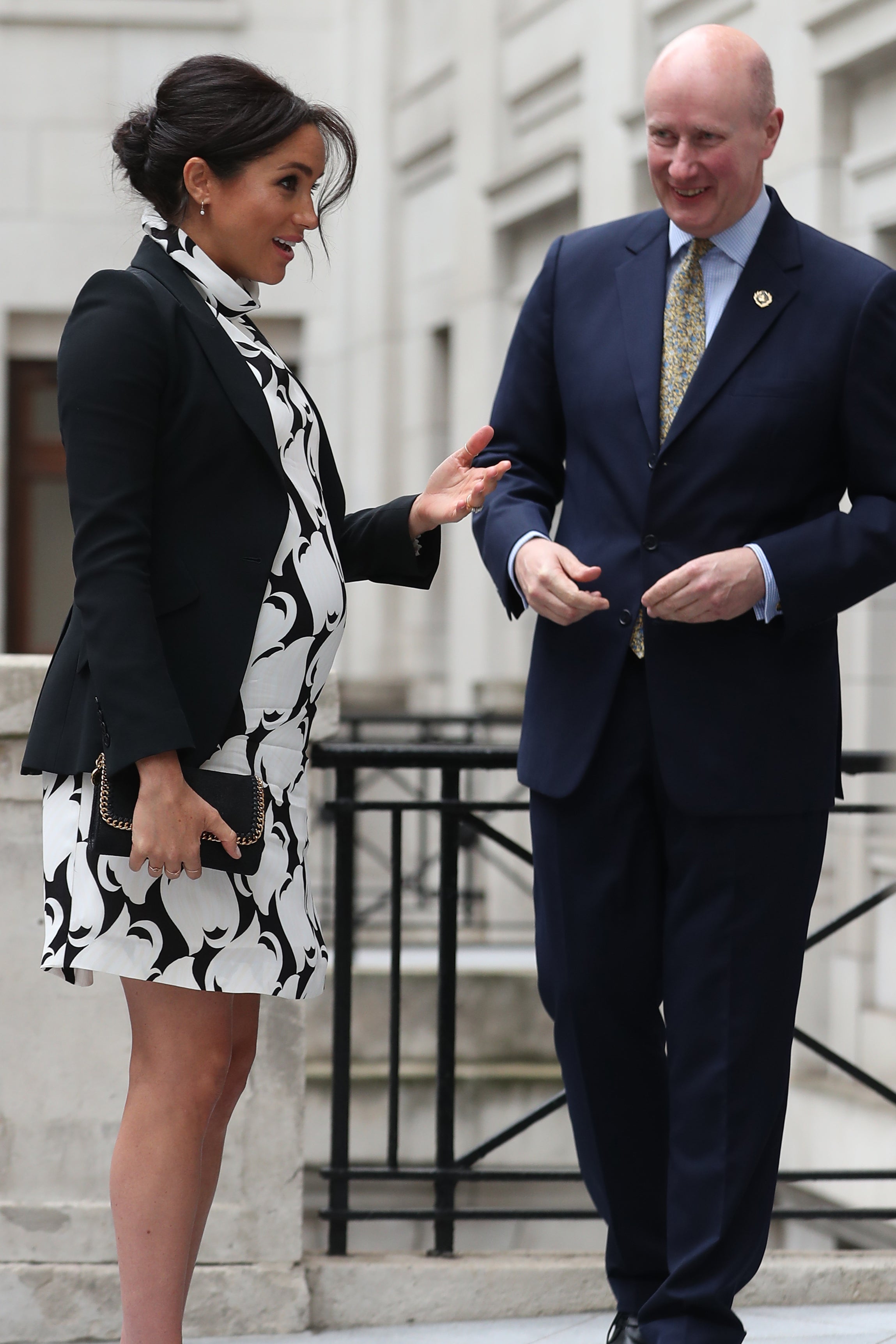 Lord Geidt, then private secretary to the Queen, greets the Duchess of Sussex in March 2019