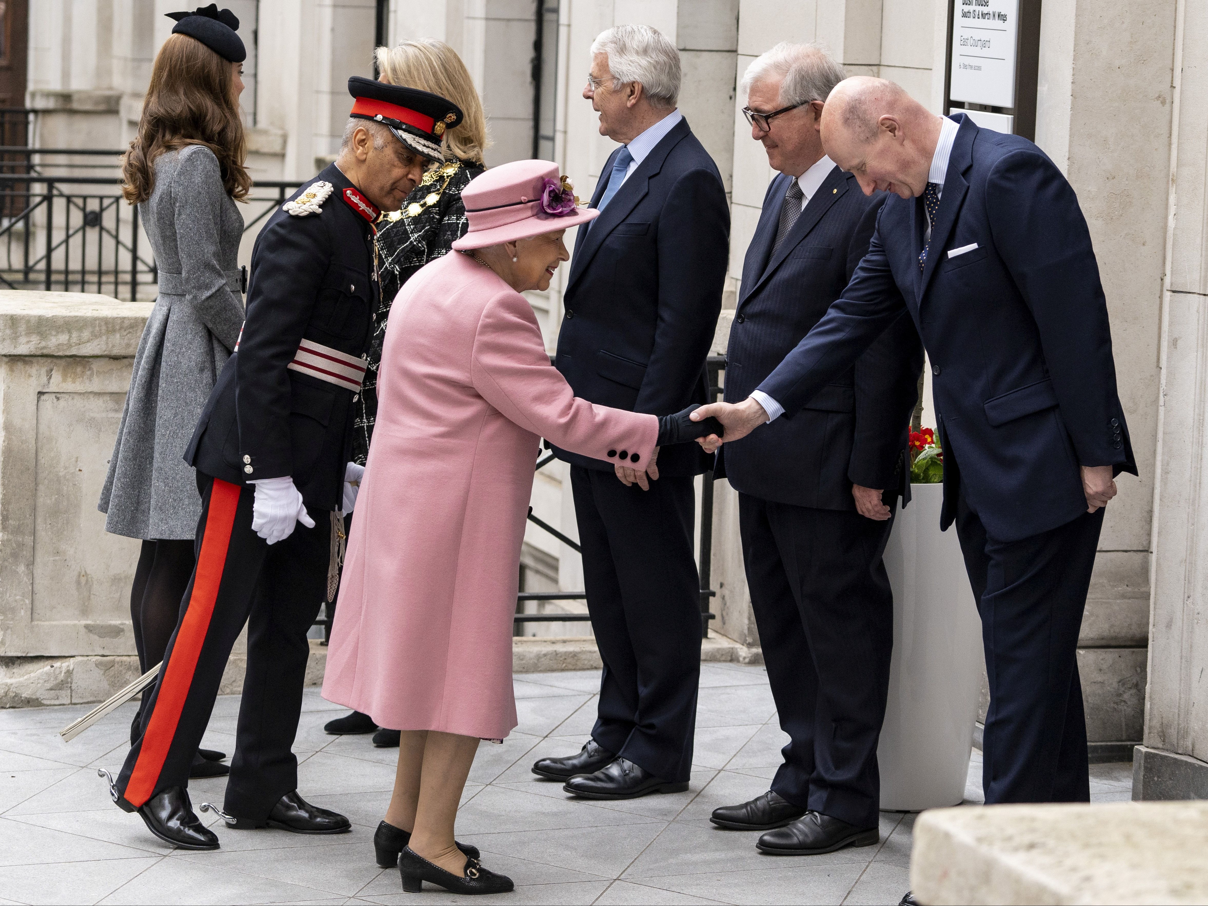 Lord Giedt shakes the Queen’s hand at an event in March 2019. He spent a decade as the monarch’s most senior aide