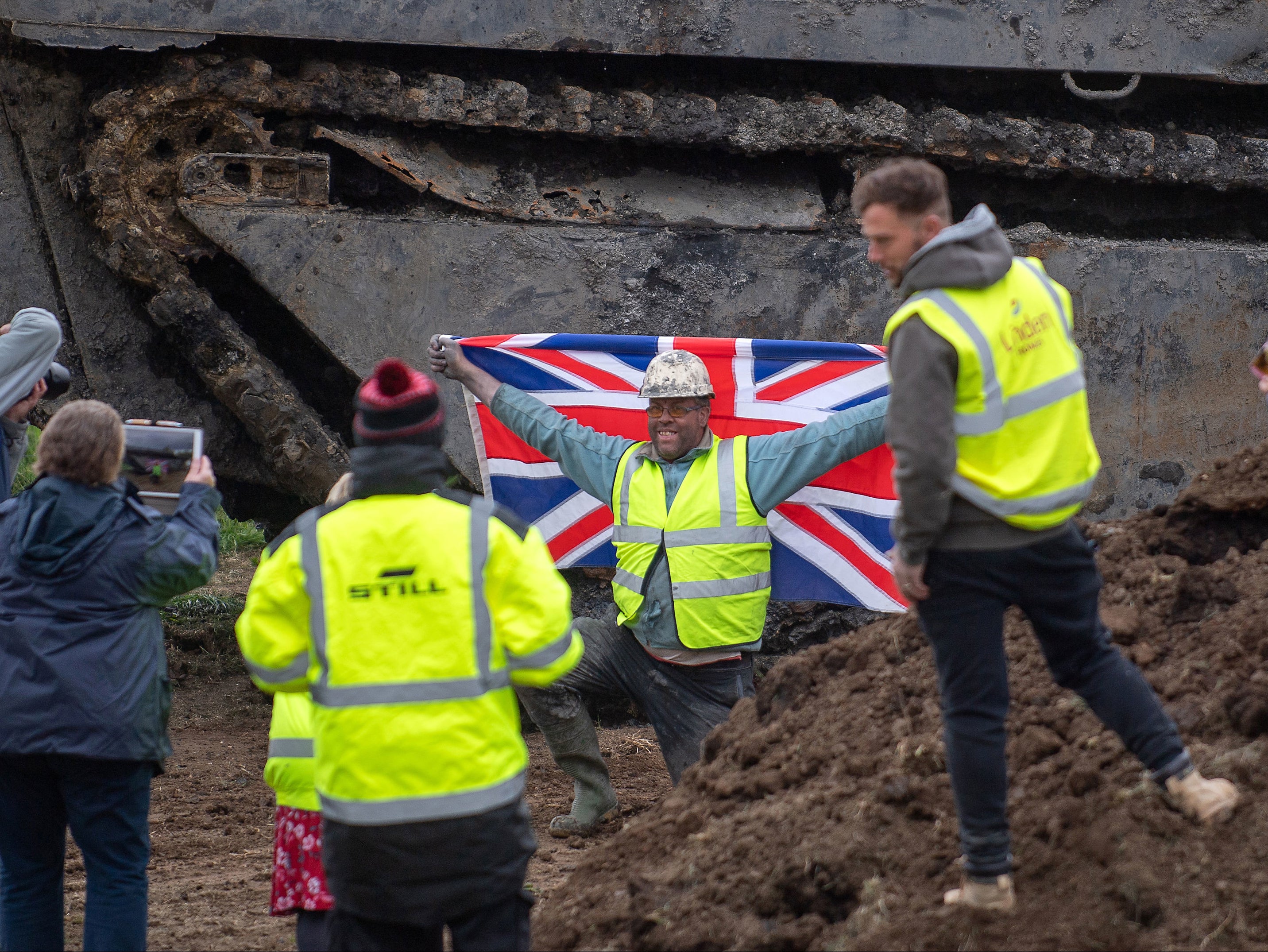 Daniel Abbott, chairman of the Crowland Buffalo LVT group, poses with the tank