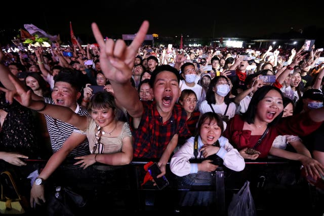<p>Fans attend a performance of a rock band at the Strawberry Music Festival during Labour Day holiday in Wuhan, China</p>