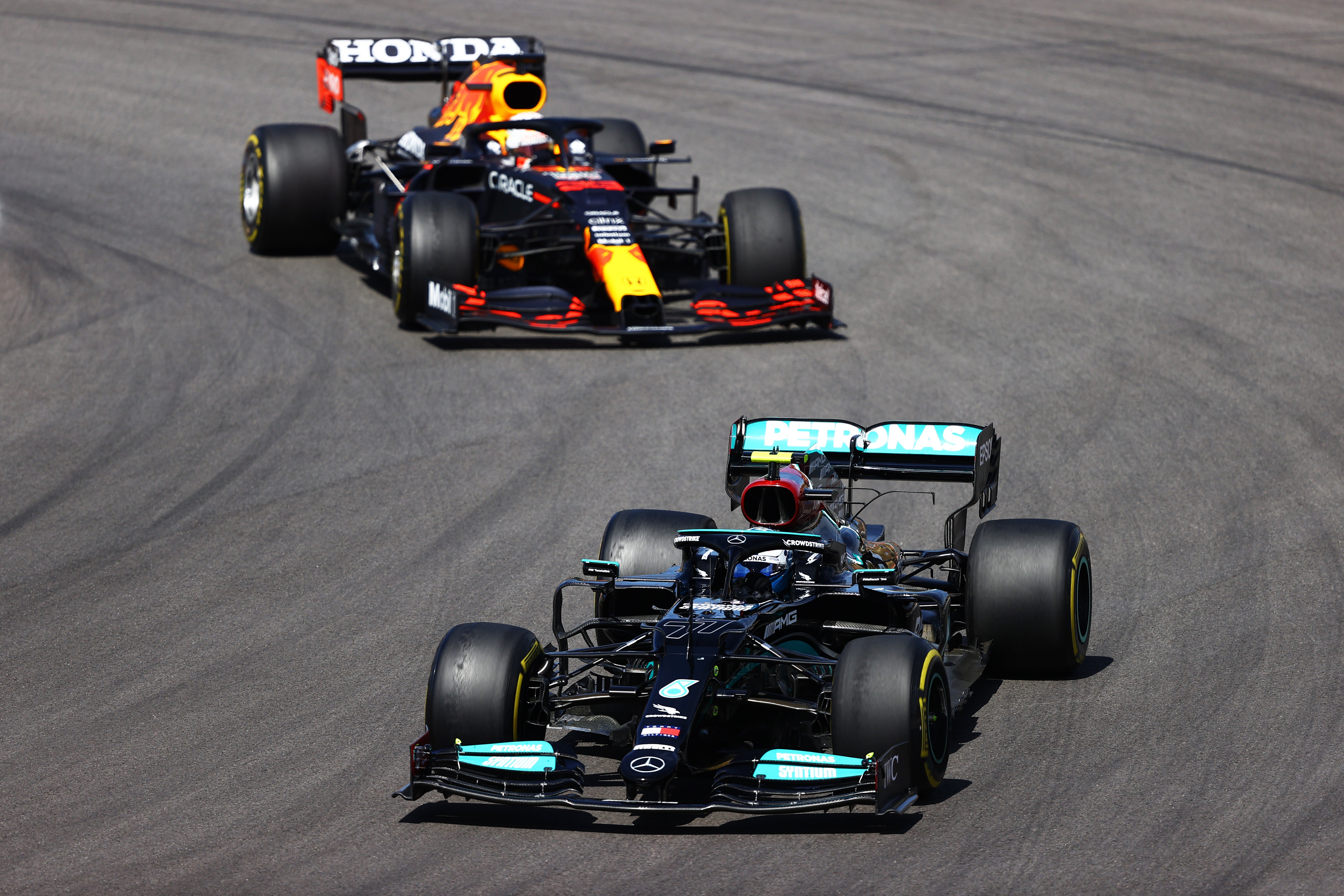 Max Verstappen (left) finished second as Valtteri Bottas came third