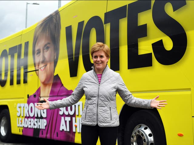 Nicola Sturgeon poses for a photograph as she campaigns in Glasgow