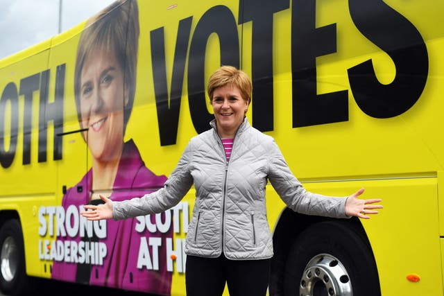 Nicola Sturgeon poses for a photograph as she campaigns in Glasgow