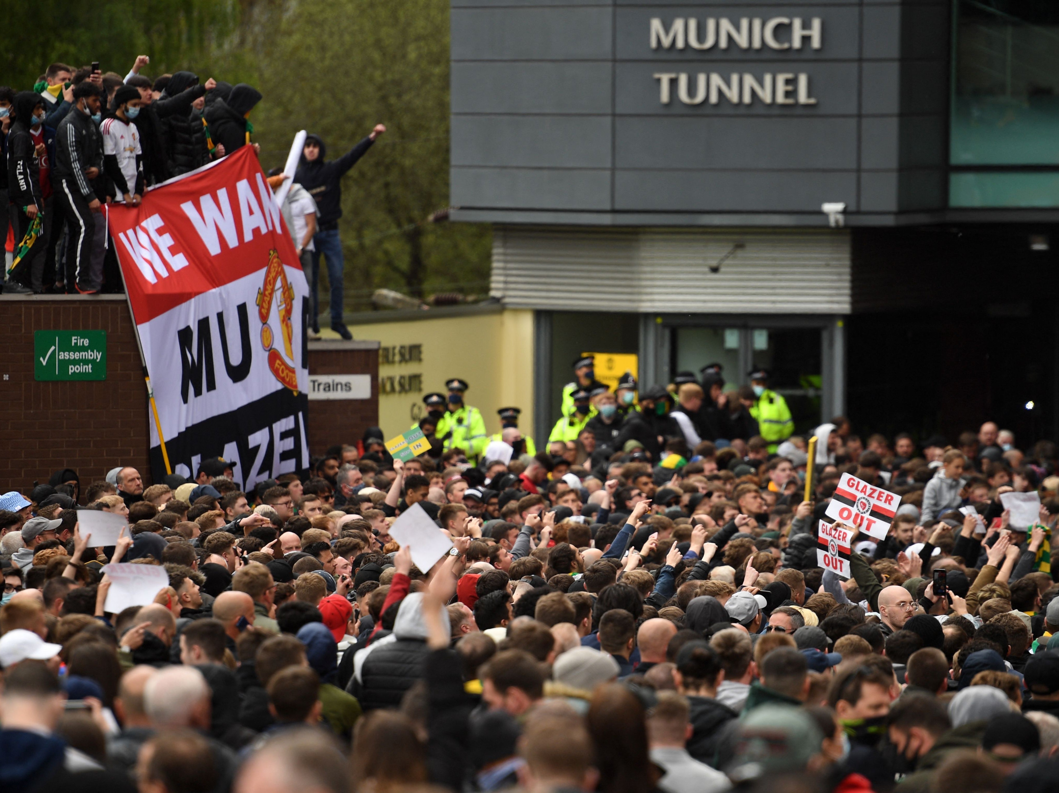 Thousands of United fans gathered outside Old Trafford, with hundreds taking to the pitch