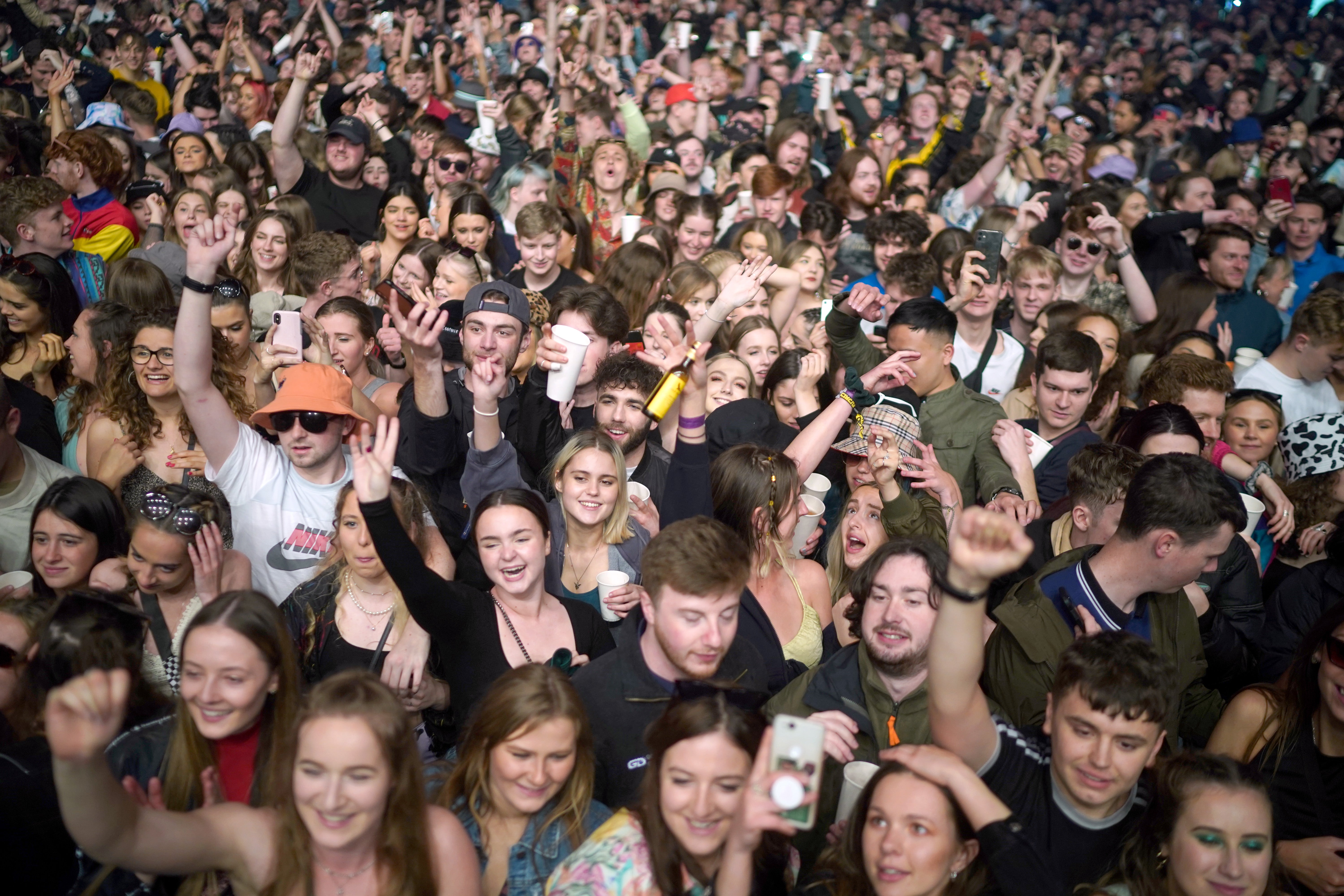 Concert-goers enjoy a non-socially distanced outdoor live music event at Sefton Park on May 2, 2021 in Liverpool