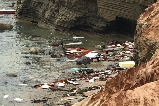<p>A handout photo by San Diego Fire-Rescue Department shows part of the wreckage of a boat that capsized near Point Loma on 2 May, 2021</p>