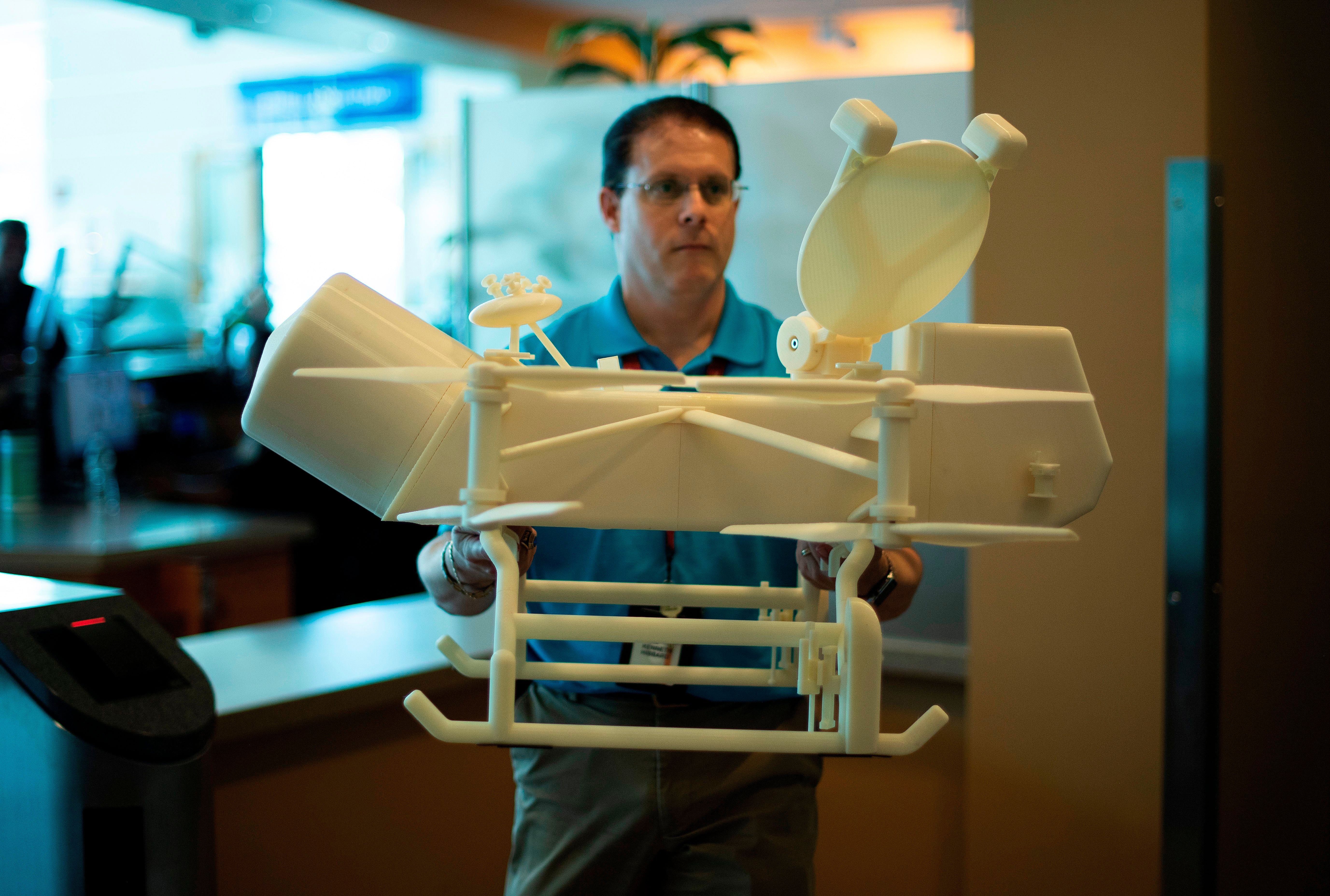 A one-quarter scale 3D-printed model of the Dragonfly drone that will land on Titan in 2034