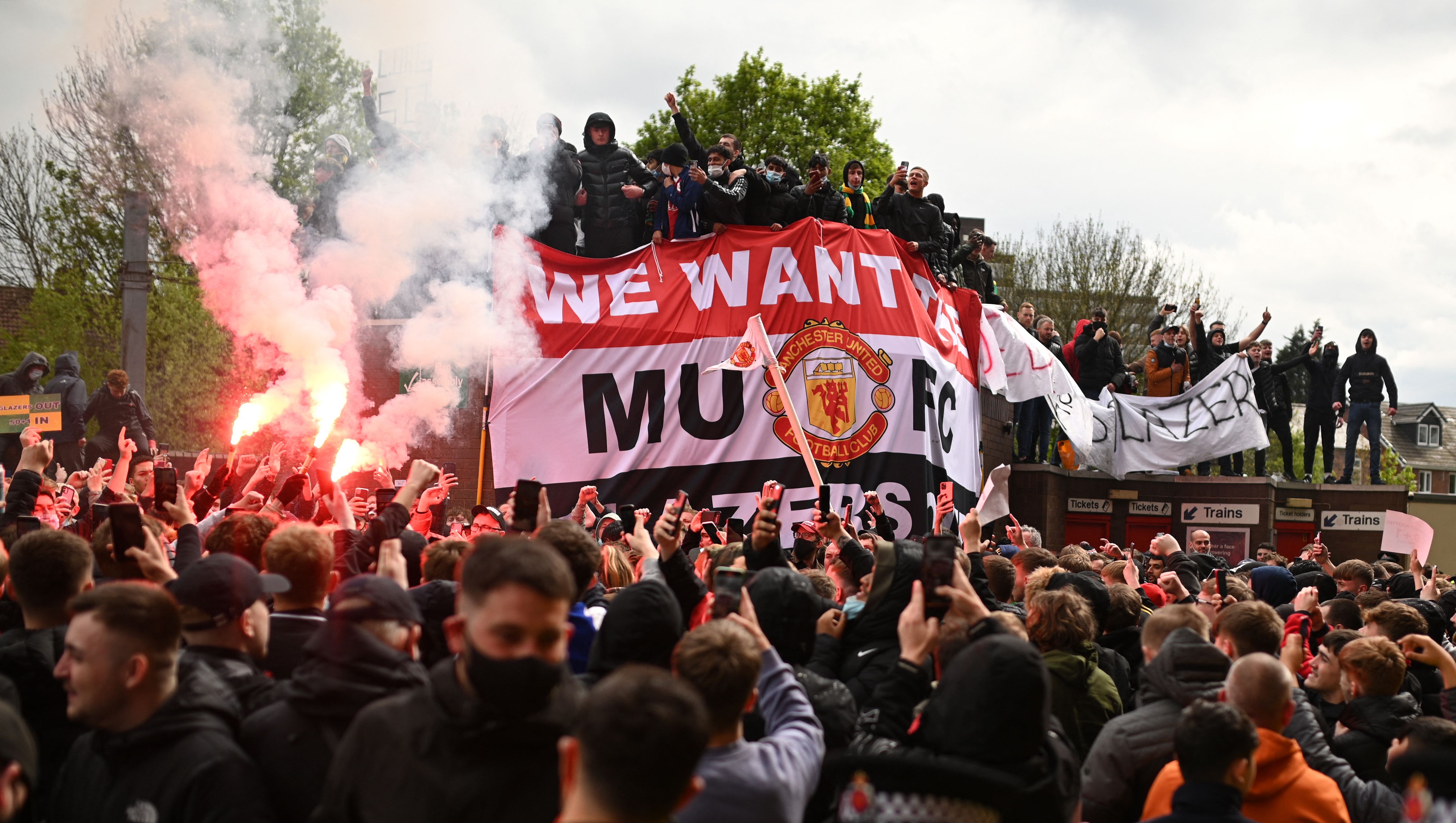 Over 1,000 Manchester United supporters protested outside Old Trafford on Sunday