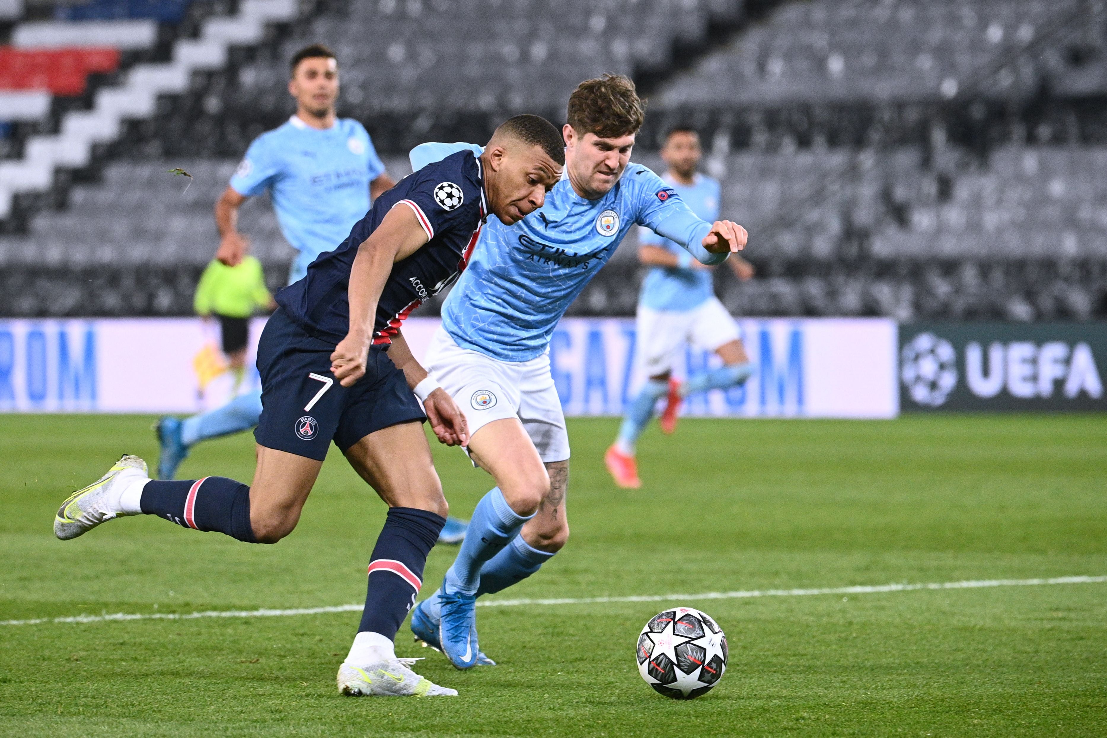 John Stones battles with Kylian Mbappe