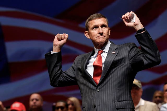 General Michael Flynn reacts at a campaign event for then Republican presidential nominee Donald Trump in Virginia Beach, Virginia, U.S., September 6, 2016. 