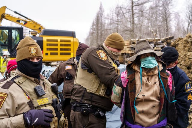 Aitkin County sheriffs arrest "water protectors" during a protest at the construction site of the Line 3 oil pipeline near Palisade, Minnesota on January 9, 2021