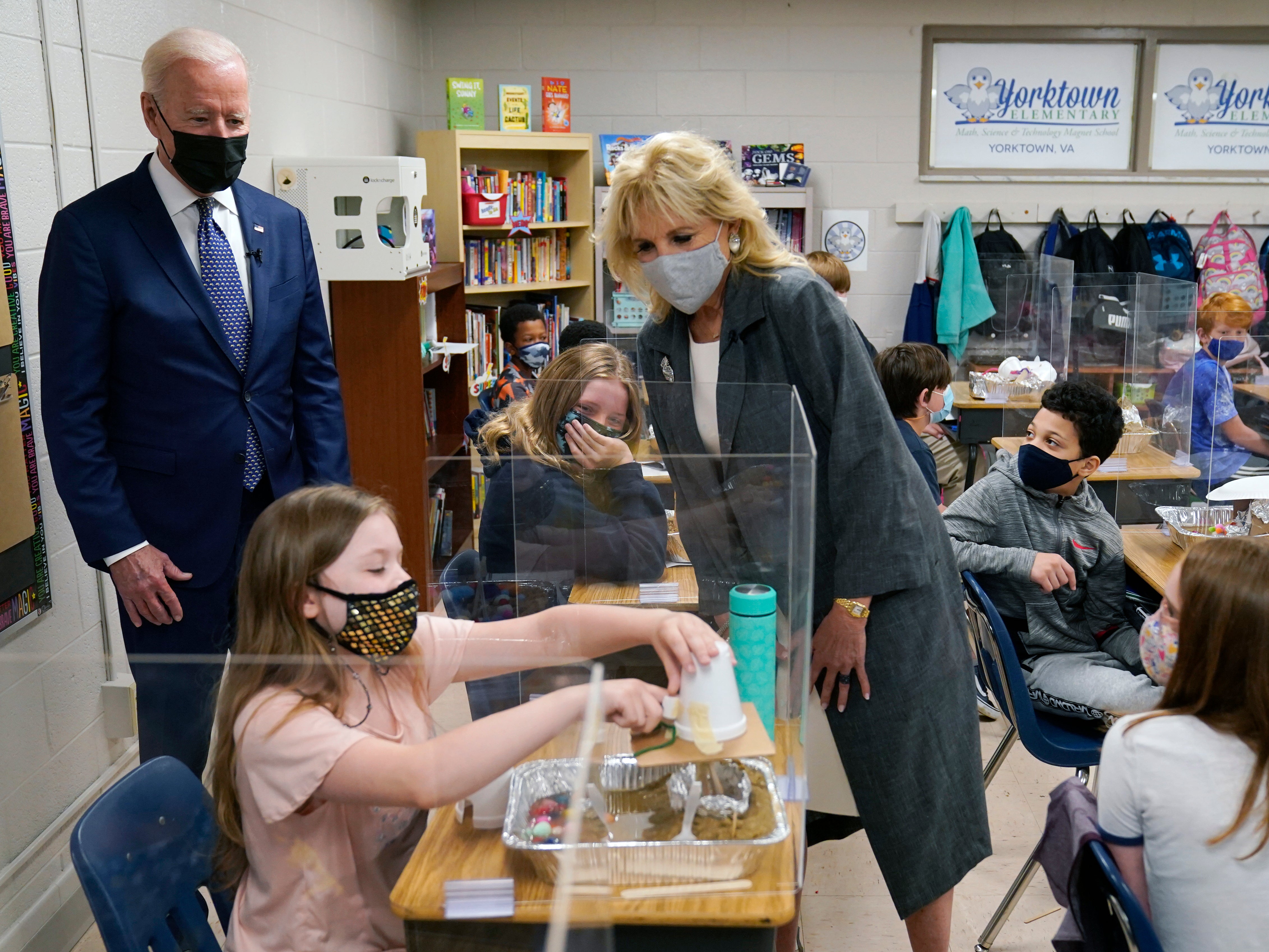 President Joe Biden and first lady Jill Biden watch a student demonstrate her project during a visit to Yorktown Elementary School, on Monday, May 3, 2021, in Yorktown, Virginia.